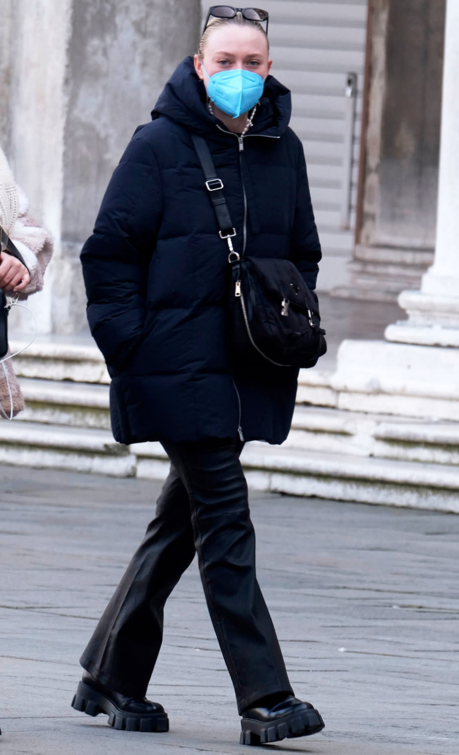 <p>Dakota Fanning masks up for a winter stroll around Piazza San Marco while in Italy filming her new show <em>Ripley</em> on Jan 22.</p>