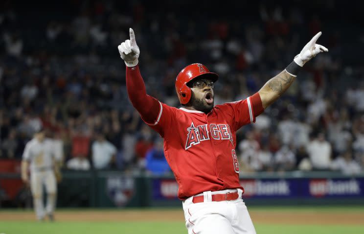 Los Angeles Angels' Eric Young Jr. celebrates his game-winning single during the 11th inning of a baseball game against the New York Yankees, Tuesday, June 13, 2017, in Anaheim, Calif. The Angels won 3-2 in the 11th inning. (AP Photo/Jae C. Hong)