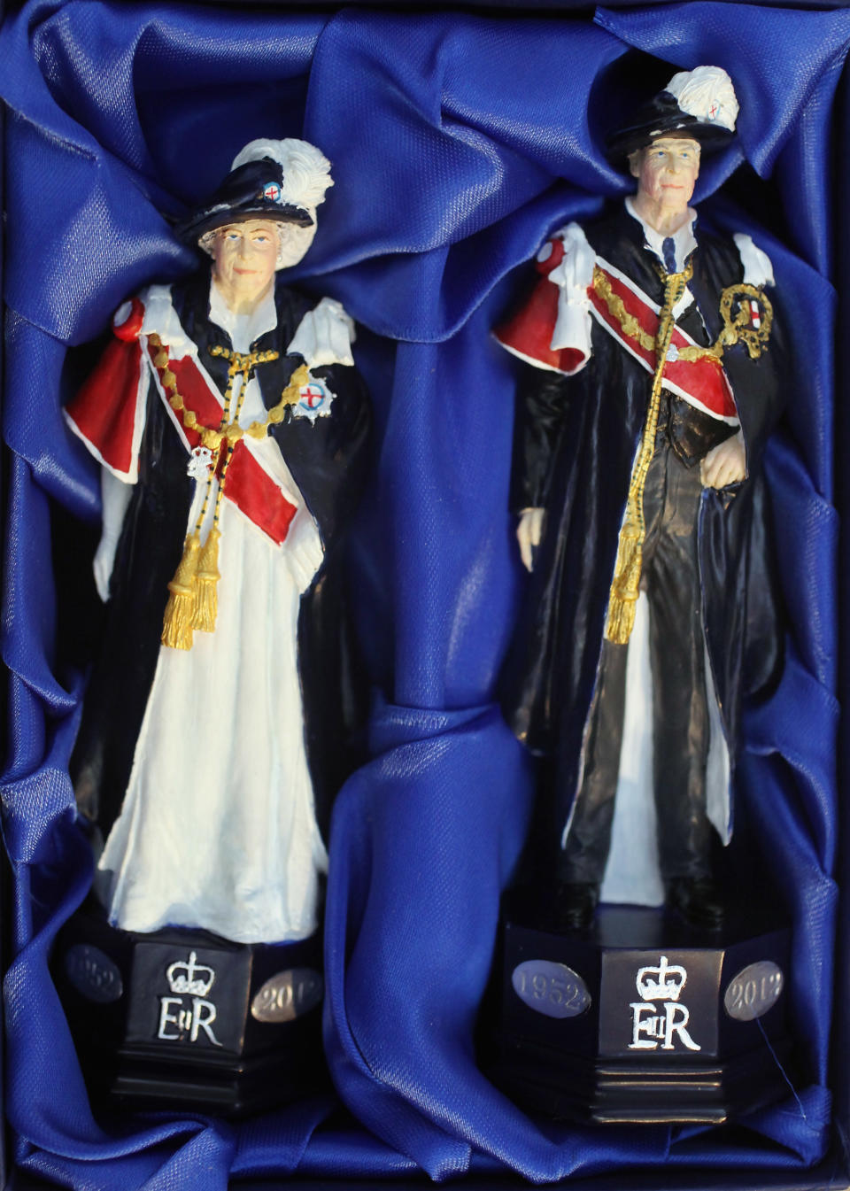 LONDON, ENGLAND - JANUARY 24: King and Queen chess pieces modelled on the British Royal family from a 'Studio Anne Carlton' set commemorating the Queen's Diamond Jubilee at the 2012 London Toy Fair at Olympia Exhibition Centre on January 24, 2012 in London, England. The annual fair which is organised by the British Toy and Hobby Association, brings together toy manufacturers with retailers from around the world. (Photo by Oli Scarff/Getty Images)