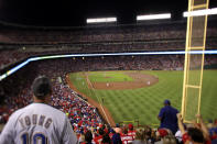 ARLINGTON, TX - OCTOBER 23: (EDITORS NOTE: Image was created using a variable planed lens.) Fans watch the action between the St. Louis Cardinals and the Texas Rangers during Game Four of the MLB World Series at Rangers Ballpark in Arlington on October 23, 2011 in Arlington, Texas. (Photo by Rob Carr/Getty Images)