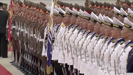 North Korean honour guards wait for South Korean President Moon Jae-in and First Lady Kim Jung-sook to arrive at Pyongyang Sunan International Airport, North Korea ahead of the third summit with North Korean leader Kim Jong Un in this still frame taken from video September 18, 2018. KBS/via REUTERS TV ATTENTION EDITORS - THIS IMAGE HAS BEEN PROVIDED BY A THIRD PARTY. NO RESALES. NO ARCHIVE. SOUTH KOREA OUT. NO COMMERCIAL OR EDITORIAL SALES IN SOUTH KOREA. NO USAGE AFTER 14 DAYS. BROADCAST: NO USE SOUTH KOREA/ NO USE AFTER 14 DAYS DIGITAL: NO USE SOUTH KOREA/ NO USE AFTER 14 DAYS.