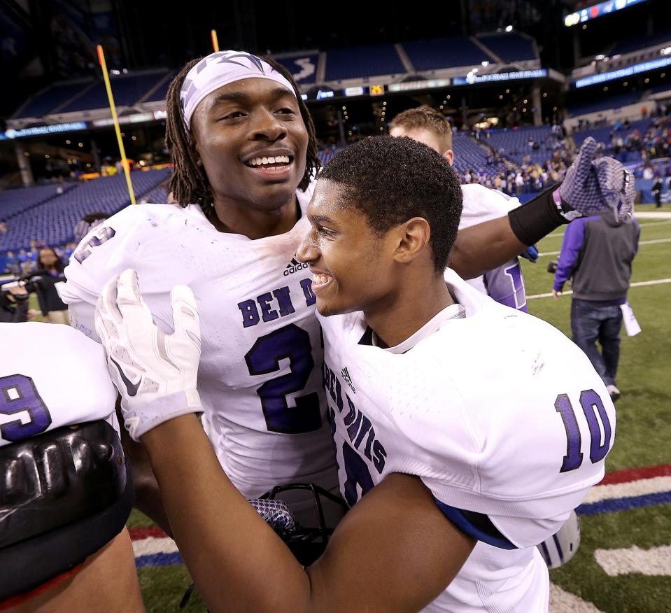 Ben Davis' Asmar Bilal, left, celebrates with Chaz Stringer, right, following their Class 6A state championship win over Carmel in 2014.