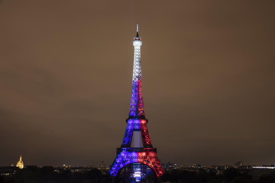 Fireworks illuminate the Eiffel Tower in Paris during Bastille Day celebrations late Wednesday, July 14, 2021. France celebrated its national holiday Wednesday with thousands of troops marching in a Paris parade, after last year's events were scaled back because of COVID-19 virus fears. (AP Photo/Lewis Joly)