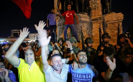 People demonstrate in front of the Republic Monument at the Taksim Square in Istanbul, Turkey, July 16, 2016. REUTERS/Murad Sezer - RTSI7JD