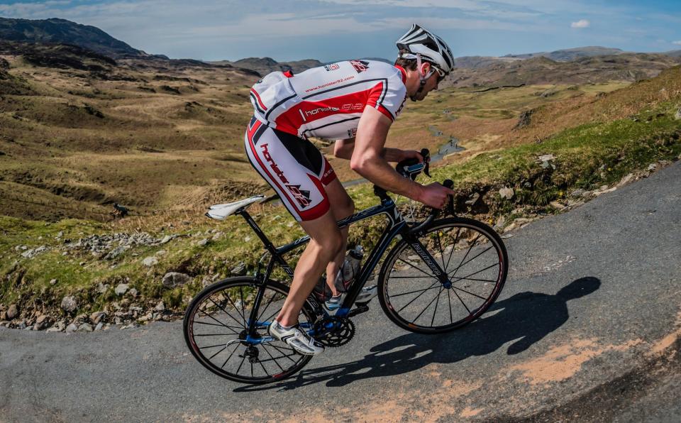 A male cyclist climbing in the English Lake District - Special report: Has Britain fallen out of love with cycling? - Alamy/Stephen Fleming