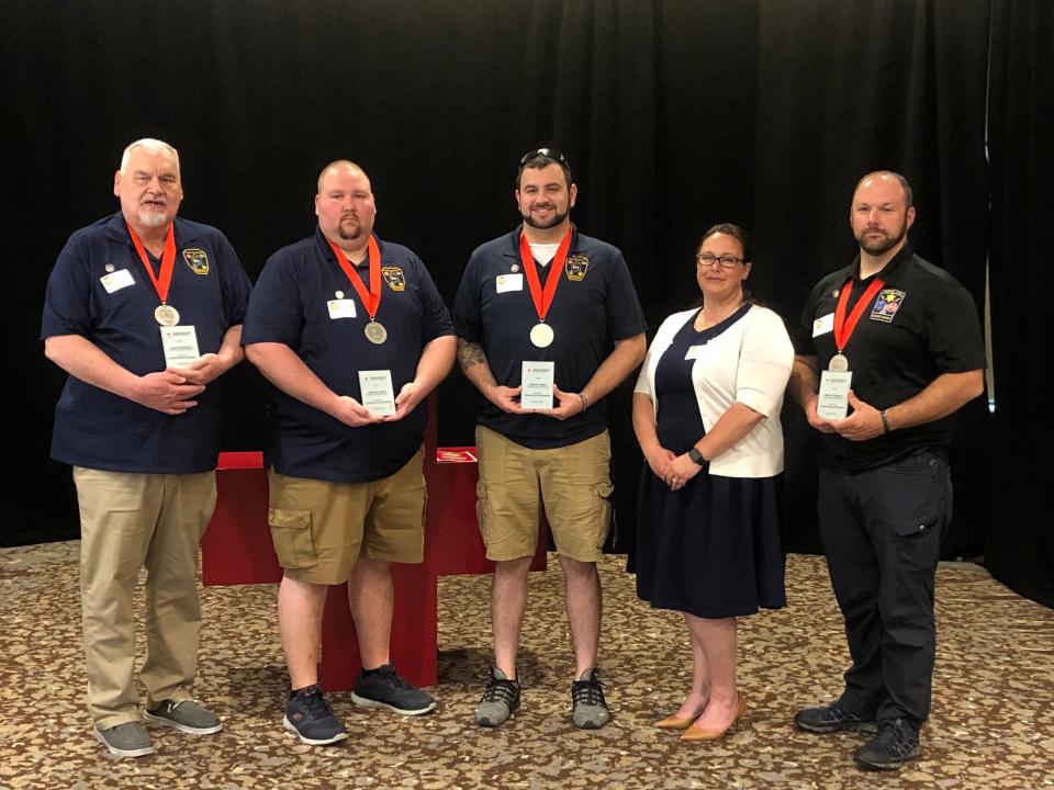 Tompkins County dispatchers Travis Collins, Lauren Dickenson and Eldon Stevens and dispatch supervisor Zachary Guidi received the American Red Cross Southern Tier Chapter "Real Heroes" Lifeline Award on May 25, 2023 inside Binghamton's DoubleTree by Hilton hotel.