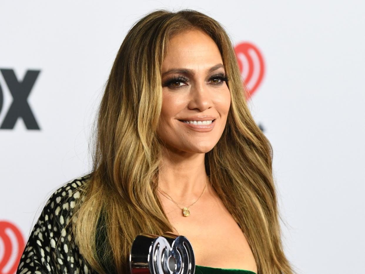 Jennifer Lopez Shows Off Her Killer Curves In This Daring And Figure Hugging V Neck Gown For