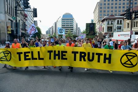 Climate change activists march down Connecticut Avenue in Washington
