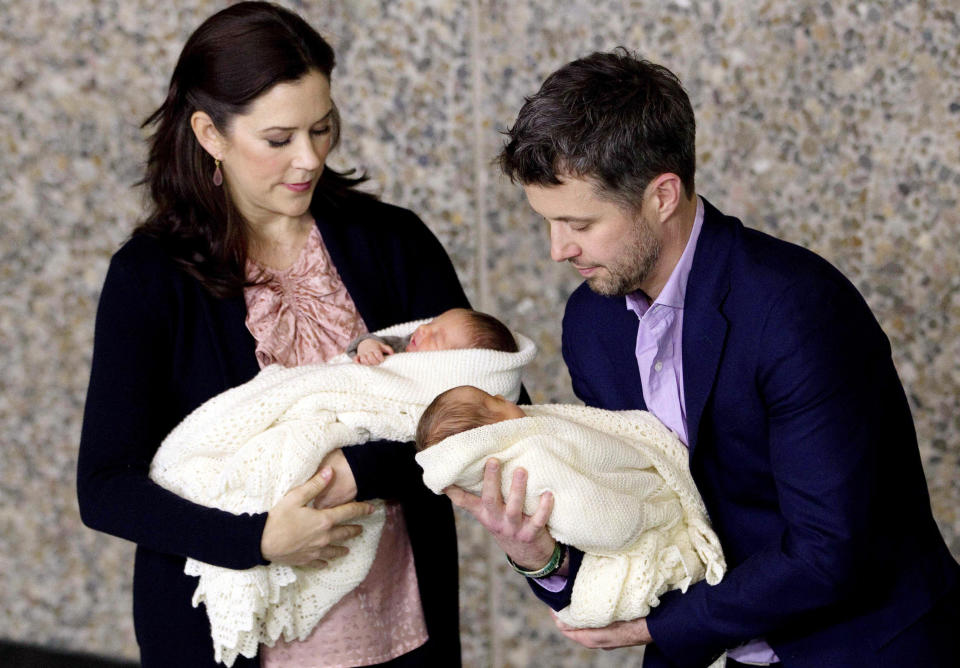 FILE - Denmark's Crown Prince Frederik holds his daughter, and Crown Princess Mary her son, as they present their newborn twins to the media at the Rigshospitalet, in Copenhagen, Denmark, Friday, Jan. 14, 2011. As a teenager, Crown Prince Frederik felt uncomfortable being in the spotlight, and pondered whether there was any way he could avoid becoming king. All doubts have been swept aside as the 55-year-old takes over the crown on Sunday, Jan. 14, 2024 from his mother, Queen Margrethe II, who is breaking with centuries of Danish royal tradition and retiring after a 52-year reign. (Finn Frandsen/Ritzau Scanpix via AP, File)