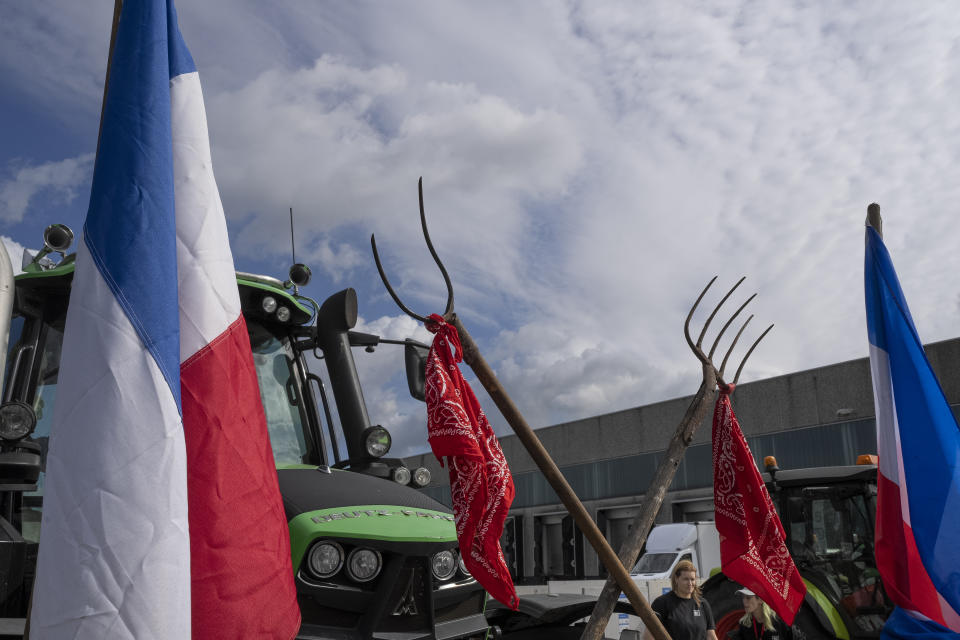 FILE- Some 25 tractors were used to blockade a distribution center for supermarket chain Albert Heijn in the town of Zaandam, just north of Amsterdam, Monday, July 4, 2022. Representatives of Dutch farmers were meeting Friday, Aug. 5, 2022 with Prime Minister Mark Rutte and other Cabinet ministers to discuss the government's nitrogen emissions reduction goals that have sparked disruptive protests in recent weeks. (AP Photo/Peter Dejong, File)