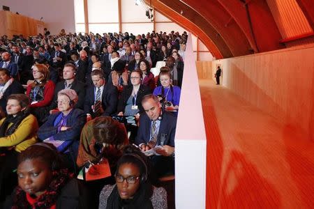 Participants attend a plenary meeting during the World Climate Change Conference 2015 (COP21) in Le Bourget, near Paris, France, December 10, 2015. REUTERS/Stephane Mahe