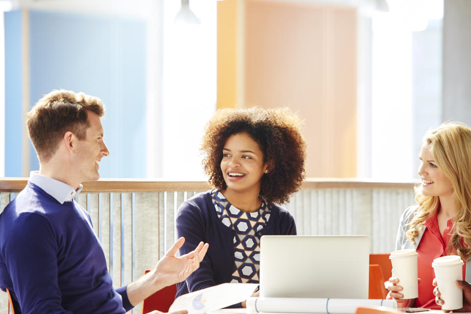 start-up office workers talking over coffee