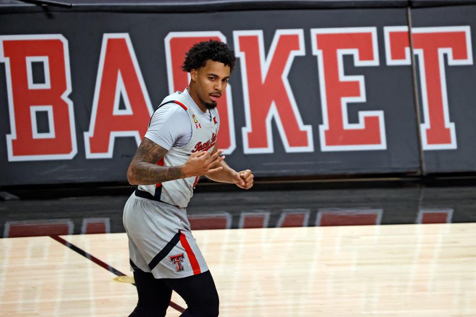 Texas Tech's Kyler Edwards (11) celebrates after scoring a three-point shot during the first half of an NCAA college basketball game against Oklahoma, Monday, Feb. 1, 2021, in Lubbock, Texas. (AP Photo/Brad Tollefson)