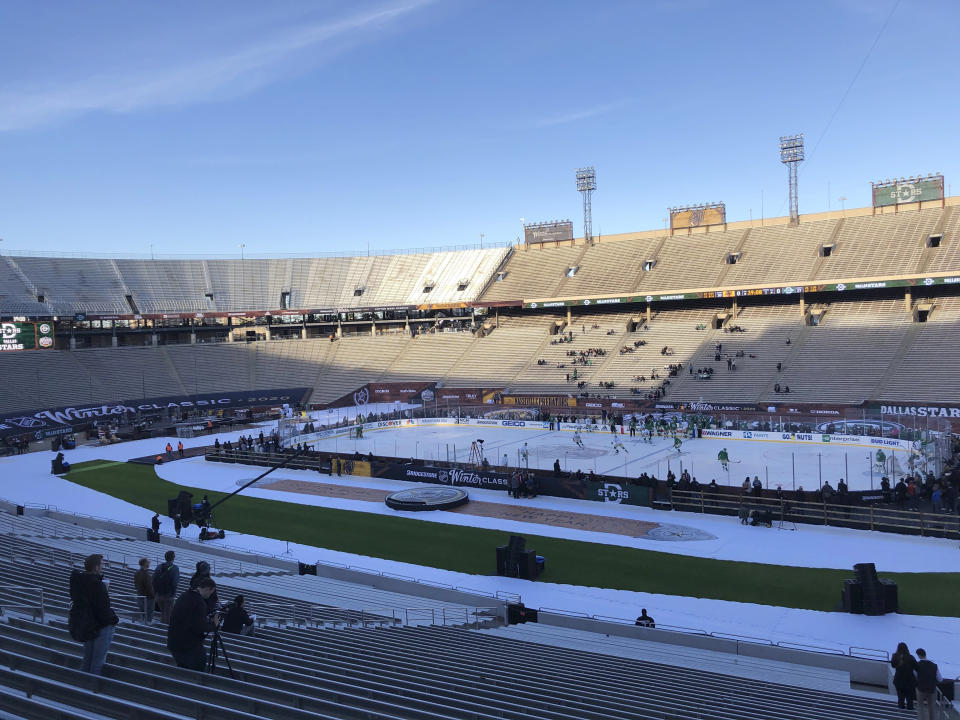 The Dallas Stars get their first time on the ice for practice, Tuesday, Dec. 31, 2019, a day before the NHL hockey Winter Classic game against the Nashville Predators at the Cotton Bowl Stadium in Dallas. (AP Photo/Stephen Hawkins)