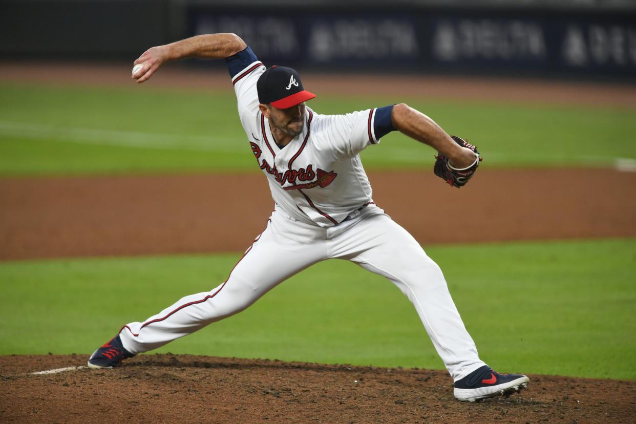 Darren O'Day, seen here pitching for the Atlanta Braves in 2020 against the Miami Marlins, became a submarine-style pitcher after being cut in his first tryout with the Florida Gators and eventually went on to a stellar college career and lasted 15 MLB seasons until the Bishop Kenny High product retired this week at age 40.