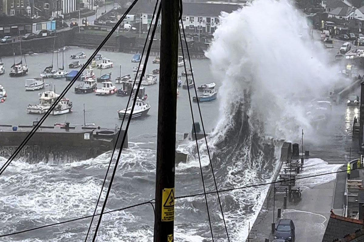 A spectacular shot of a wave exploding in Porthleven harbour <i>(Image: Giles Clotworthy)</i>