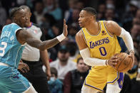 Charlotte Hornets guard Terry Rozier (3) guards against Los Angeles Lakers guard Russell Westbrook (0) during the first half of an NBA basketball game in Charlotte, N.C., Friday, Jan. 28, 2022. (AP Photo/Jacob Kupferman)