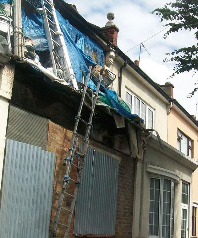 Tarps and ladders are tied together with string. Photo: Caters