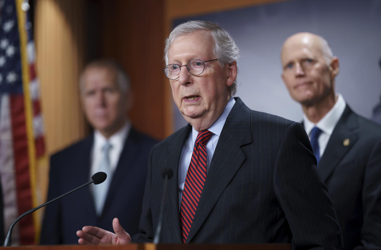 Senate Minority Leader Mitch McConnell, R-Ky., joined by GOP leaders, talks to reporters briefly to warn that Republicans will block the House-passed measure to keep the government funded and suspend the federal debt limit despite setting up a high-stakes showdown that will risk of triggering a fiscal crisis, at the Capitol in Washington, Wednesday, Sept. 22, 2021. (AP Photo/J. Scott Applewhite)