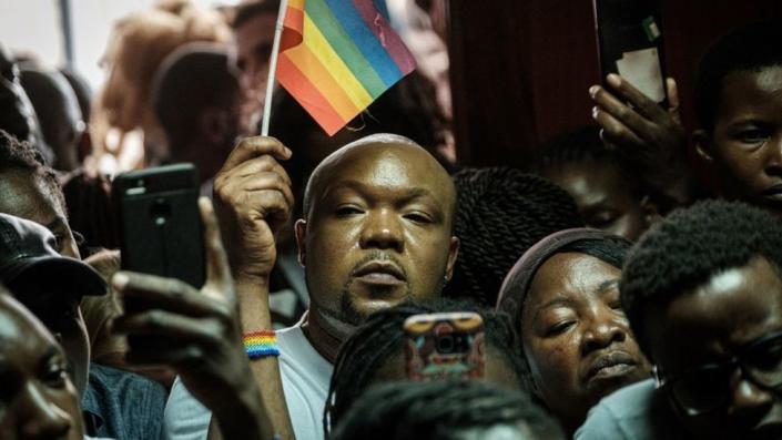 Members and supporters of the LGBTQ community listen to a verdict on the abolition of laws criminalizing homosexuality outside the Milimani High Court in Nairobi, Kenya on May 24, 2019.