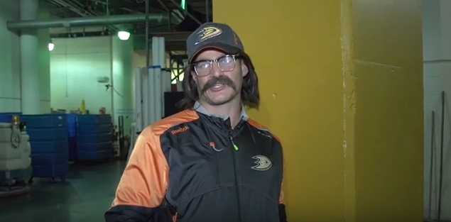 Anaheim Ducks defenseman Kevin Bieksa goes undercover as 'shovelboy' during a preseason game. 