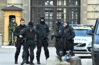 Police stand outside Stockholm Castle after a truck crashed into the Ahlens department store at Drottninggatan in central Stockholm, April 7, 2017