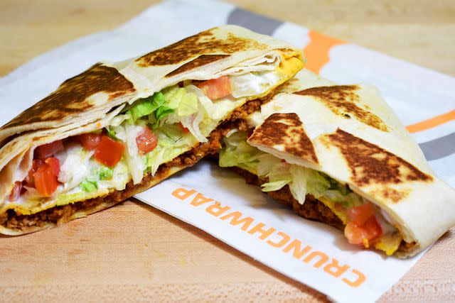 <p>Joshua Blanchard / Getty Images</p> Taco Bell has a discounted Crunchwrap on Feb. 29