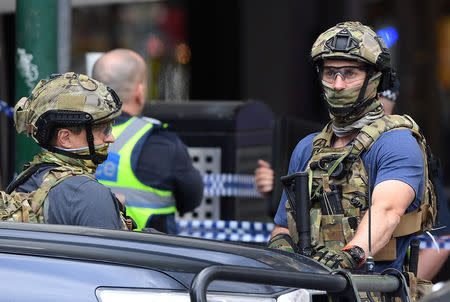 Armed security personnel stand near the Bourke Street mall in central Melbourne, Australia, November 9, 2018. AAP/James Ross/via REUTERS