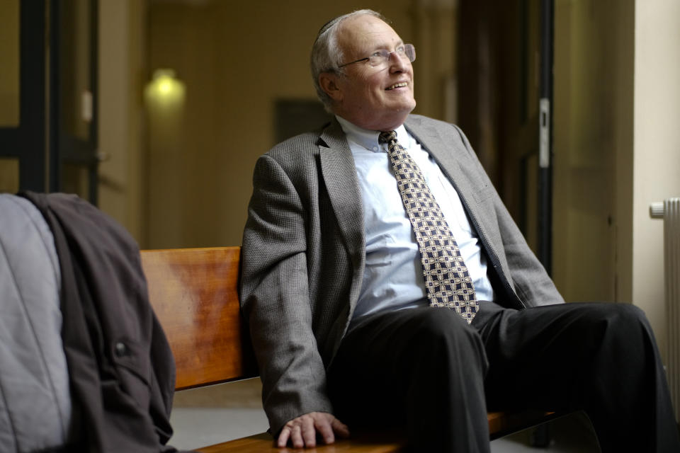 Efraim Zuroff, the head Nazi hunter from Simon Wiesenthal Center, pauses during an television interview at the criminal court in Hamburg, Thursday, Oct. 17, 2019. 93-year-old former SS private Bruno Dey is going on trial at the court on 5,230 counts of being an accessory to murder, accused of helping the Nazis' Stutthof concentration camp function. (AP Photo/Markus Schreiber)