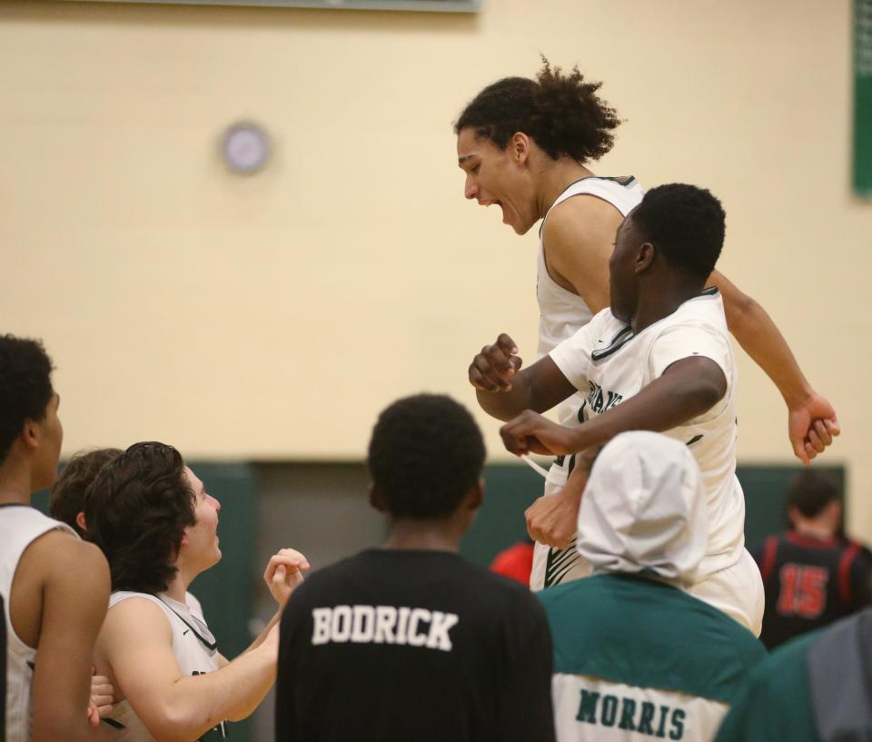 Spackenkill's Kristopher Cummings and Lamine Sesay celebrate their win over Port Jervis in the Section 9 Class A boys basketball quarter final on February 26 2024.