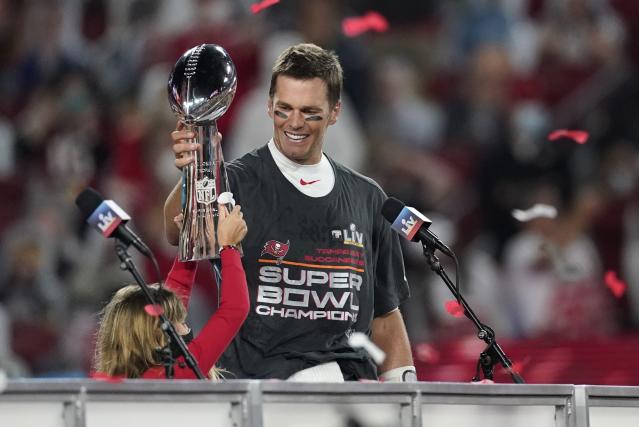 Tampa, United States. 08th Feb, 2021. Super Bowl MVP Tom Brady holds  daughter Vivian Brady who reaches for falling confetti during the Vince  Lombardi Trophy Presentation after Super Bowl LV at Raymond