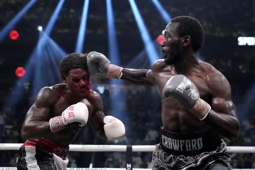 Terence Crawford hits Errol Spence Jr. and blood mixed with sweat flies during their boxing match