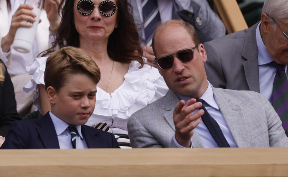 Tennis - Wimbledon - All England Lawn Tennis and Croquet Club, London, Britain - July 16, 2023 Britain's Prince George and Britain's Prince William, Prince of Wales in the royal box during the men's singles final REUTERS/Andrew Couldridge