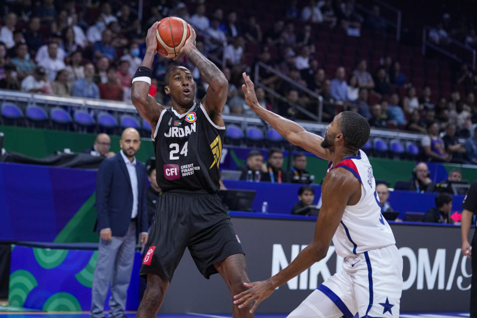 Jordan forward Rondae Hollis Jefferson (24) shoots over U.S. forward Mikal Bridges (5) during the first half of a Basketball World Cup group C match in Manila, Philippines Wednesday, Aug. 30, 2023. (AP Photo/Michael Conroy)