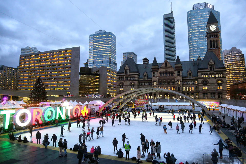 People enjoy ice skating at an outdoor ice rink in Nathan Phillips Square in downtown Toronto, Ontario, Canada, on December 17, 2018. (Photo by Creative Touch Imaging Ltd./NurPhoto)