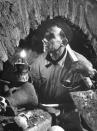 In a clutter of bones and artifacts the foreman of a team of Vatican workmen examines an ancient archway, St. Peter's, Rome, 1950. (Nat Farbman—Time & Life Pictures/Getty Images) <br> <br> <a href="http://life.time.com/culture/the-vatican-unearthing-history-beneath-st-peters-1950-photos/#1" rel="nofollow noopener" target="_blank" data-ylk="slk:Click here to see the full collection at LIFE.com;elm:context_link;itc:0;sec:content-canvas" class="link ">Click here to see the full collection at LIFE.com</a>