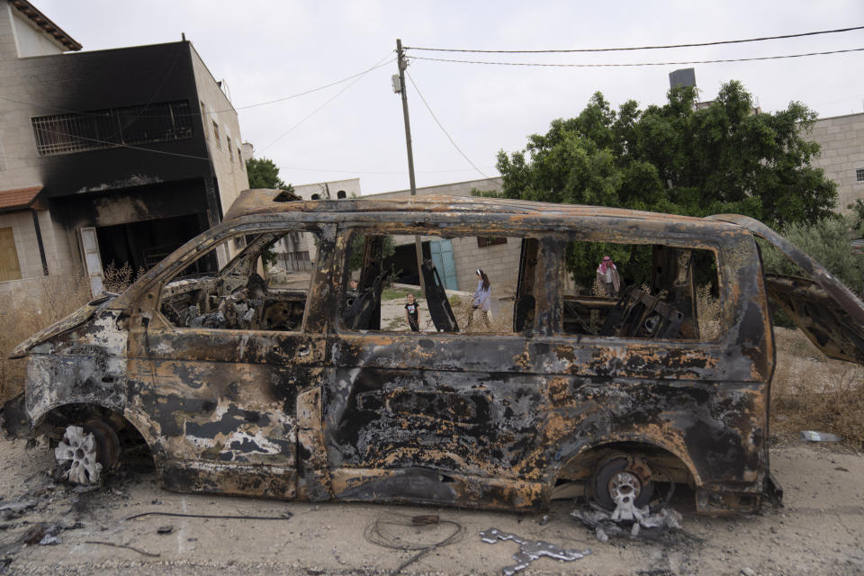 House and vehicles of Ibrahim Dawabsha and his family that were torched during an attack by Israel settlers last month, in the West Bank village of Duma, Tuesday, April 30, 2024. (AP Photo/Nasser Nasser)