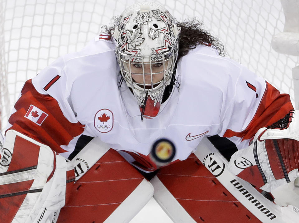 FILE - In this Thursday, Feb. 22, 2018 file photo, goalie Shannon Szabados (1), of Canada, stares at the flying puck during the second period of the women's gold medal hockey game against the United States at the 2018 Winter Olympics in Gangneung, South Korea. Tyler Tumminia is leaving the door open should members of the Professional Women’s Hockey Players’ Association ever want to reach out to the National Women’s Hockey League in a bid to thaw what’s been a chilly relationship. PWHPA member and former Canadian national team goalie Shannon Szabados was skeptical. “Until I see a league in North America that I would want my daughter to play in, my stance with the PWHPA remains united to create a better opportunity for future generations,” Szabados wrote in a text. (AP Photo/Matt Slocum, File)