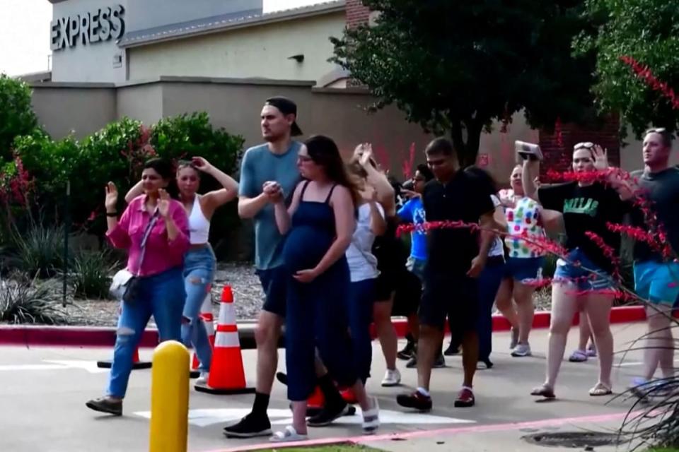 <div class="inline-image__caption"><p>Shoppers leave with their hands up after police responded to a gunman who shot and killed eight people and wounded at least seven others at Allen Premium Outlets mall. </p></div> <div class="inline-image__credit">Reuters TV/Reuters</div>