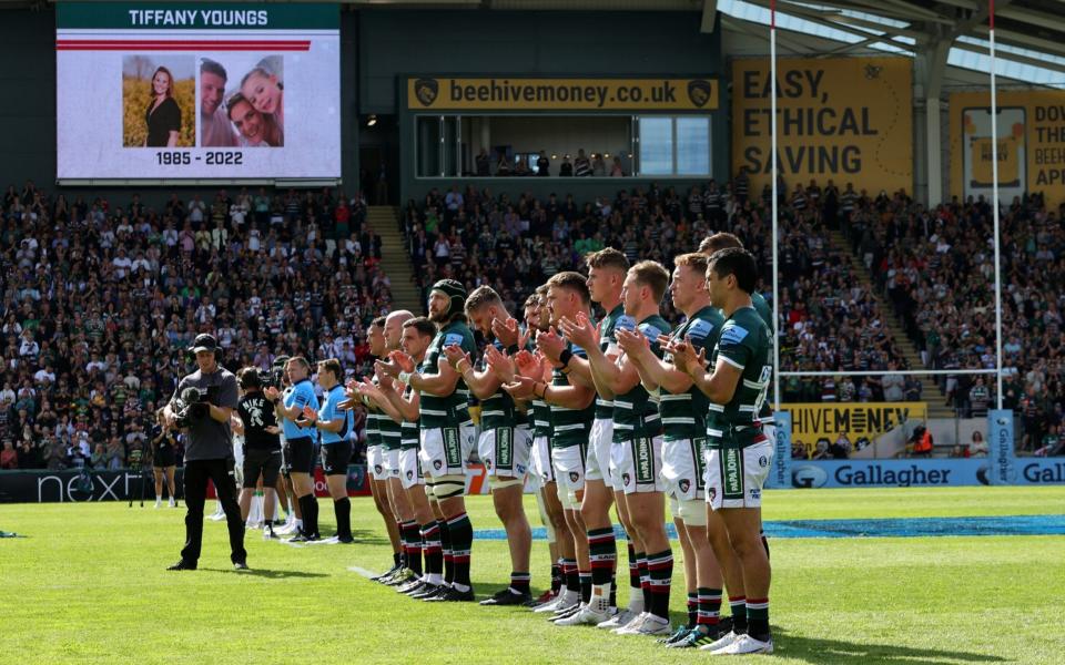 Players of Northampton Saints and Leicester Tigers hold a minutes applause in memory of Tiffany Youngs, wife of former Leicester Tigers player Tom Youngs - Getty Images