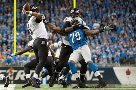 Dec 16, 2013; Detroit, MI, USA; Detroit Lions defensive end Willie Young (79) pressures Baltimore Ravens quarterback Joe Flacco (5) during the fourth quarter at Ford Field. Mandatory Credit: Tim Fuller-USA TODAY Sports