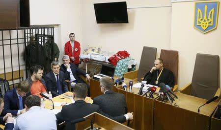 Head of Ukraine's tax and customs service Roman Nasirov (4th L), who is under investigation over the suspected embezzlement, attends a court hearing in Kiev, Ukraine, March 6, 2017. REUTERS/Valentyn Ogirenko