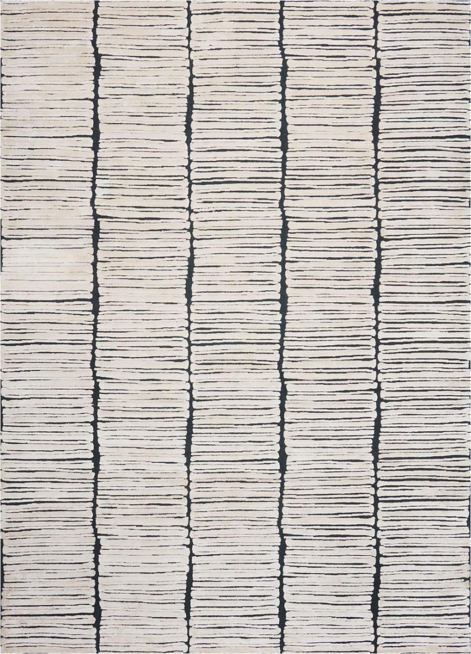 striated rug in blues and off white