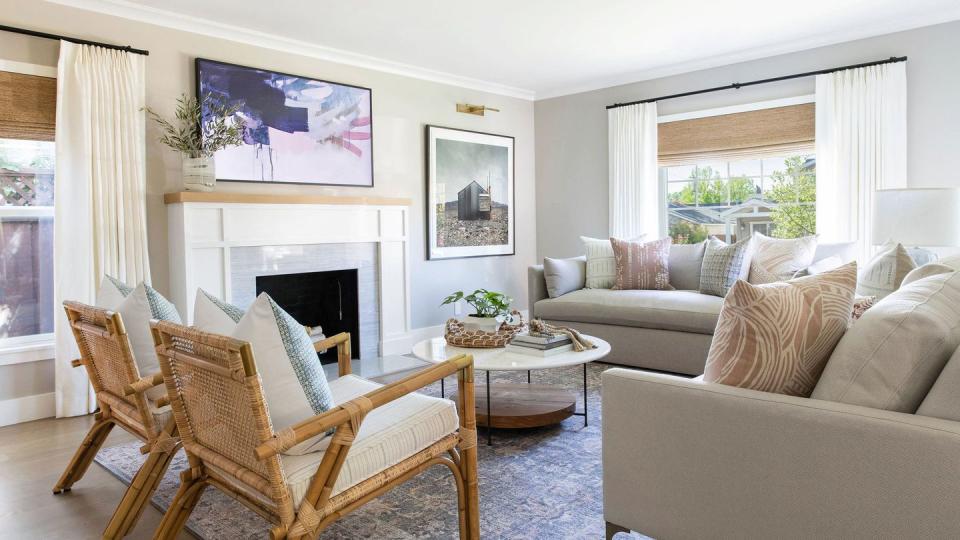 living room with white curtains and fabric shades