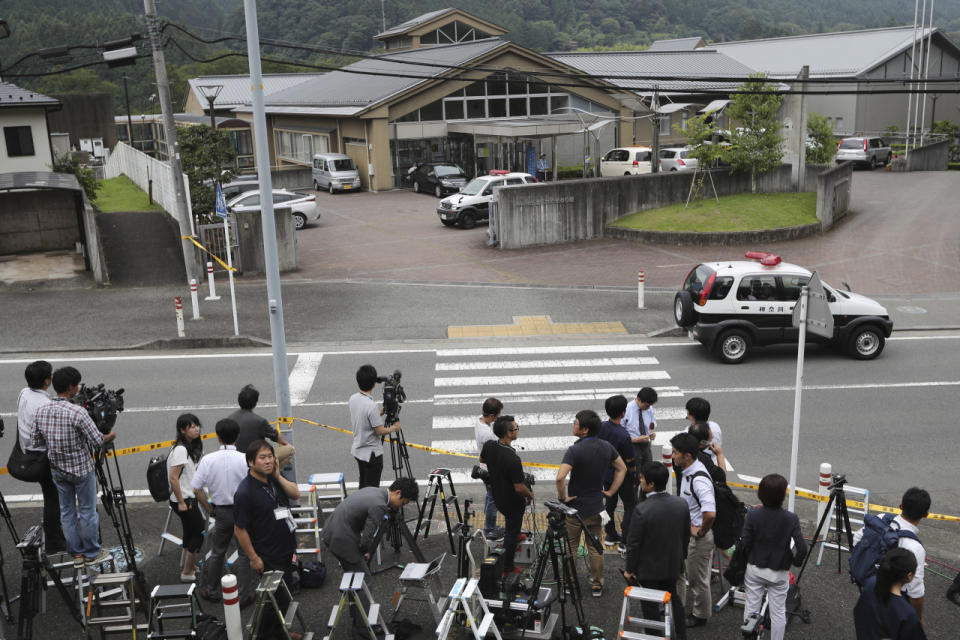 <p>Journalists gather in front of Tsukui Yamayuri-en, a facility for the handicapped where a number of people were killed and dozens injured in a knife attack in Sagamihara, outside Tokyo Tuesday, July 26, 2016. (AP Photo/Eugene Hoshiko)</p>