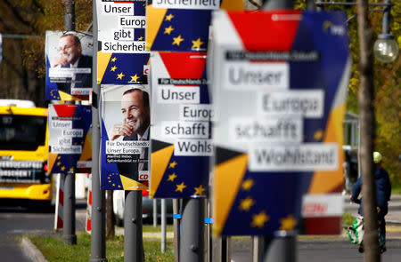 Election campaign posters of Germany's conservative Christian Democratic Union (CDU) party and Christian Social Union (CSU) party for the upcoming European Parliament elections, depicting also Manfred Weber, top candidate of the European People's Party (EPP), are pictured in Berlin, Germany April 15, 2019. The posters read "For Germany's future, our Europe" and "Our Europe creates prosperity" REUTERS/Fabrizio Bensch