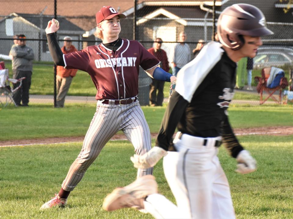Oriskany pitcher Eddie Wright throws to first base after fielding a bunt against Frankfort-Schuyler April 29.