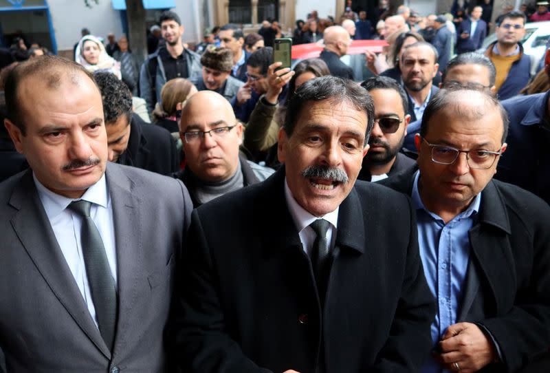 Tunisian prominent activist, Ayachi Hammami, speaks outside a court in Tunis