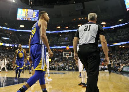 Golden State Warriors guard Stephen Curry (30) argues with referee Scott Wall (31) during the second half against the Memphis Grizzlies at FedExForum, Oct 21, 2017; Memphis, TN, USA. Memphis defeated Golden State 111-101. Mandatory Credit: Justin Ford-USA TODAY Sports