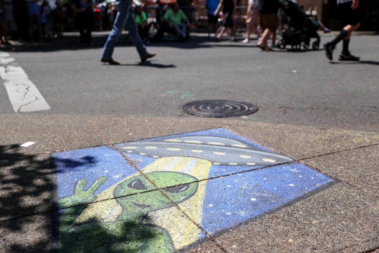 Alien art is seen on a street corner during the 23rd annual McMenamins UFO Festival, Saturday, May 20, 2023, in McMinnville, Ore.